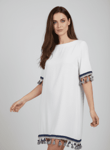 White dress with blue edging and tassels.