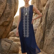 Sleeveless viscose dress in blue marine with ecru trim and tassel tie. Elegant, airy and ideal for premium summer and resort styling.